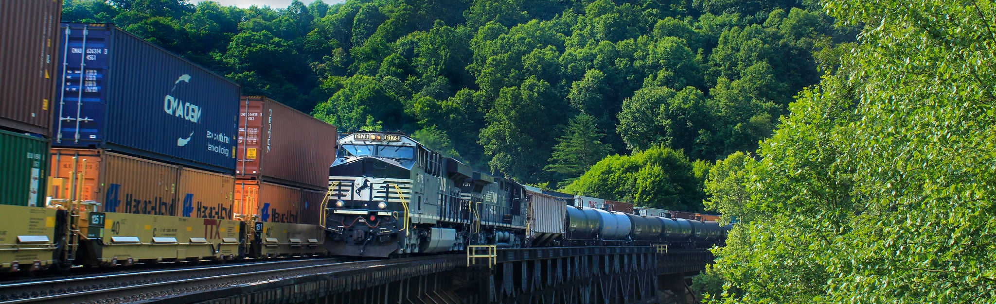 Oil car train passing Transload train