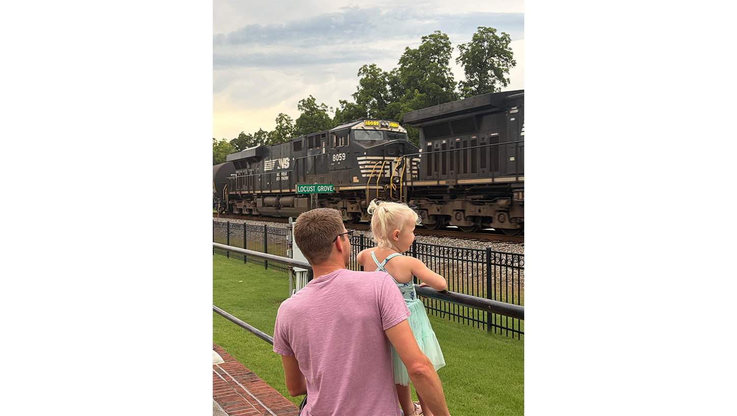 Brian and daughter watch a NS train