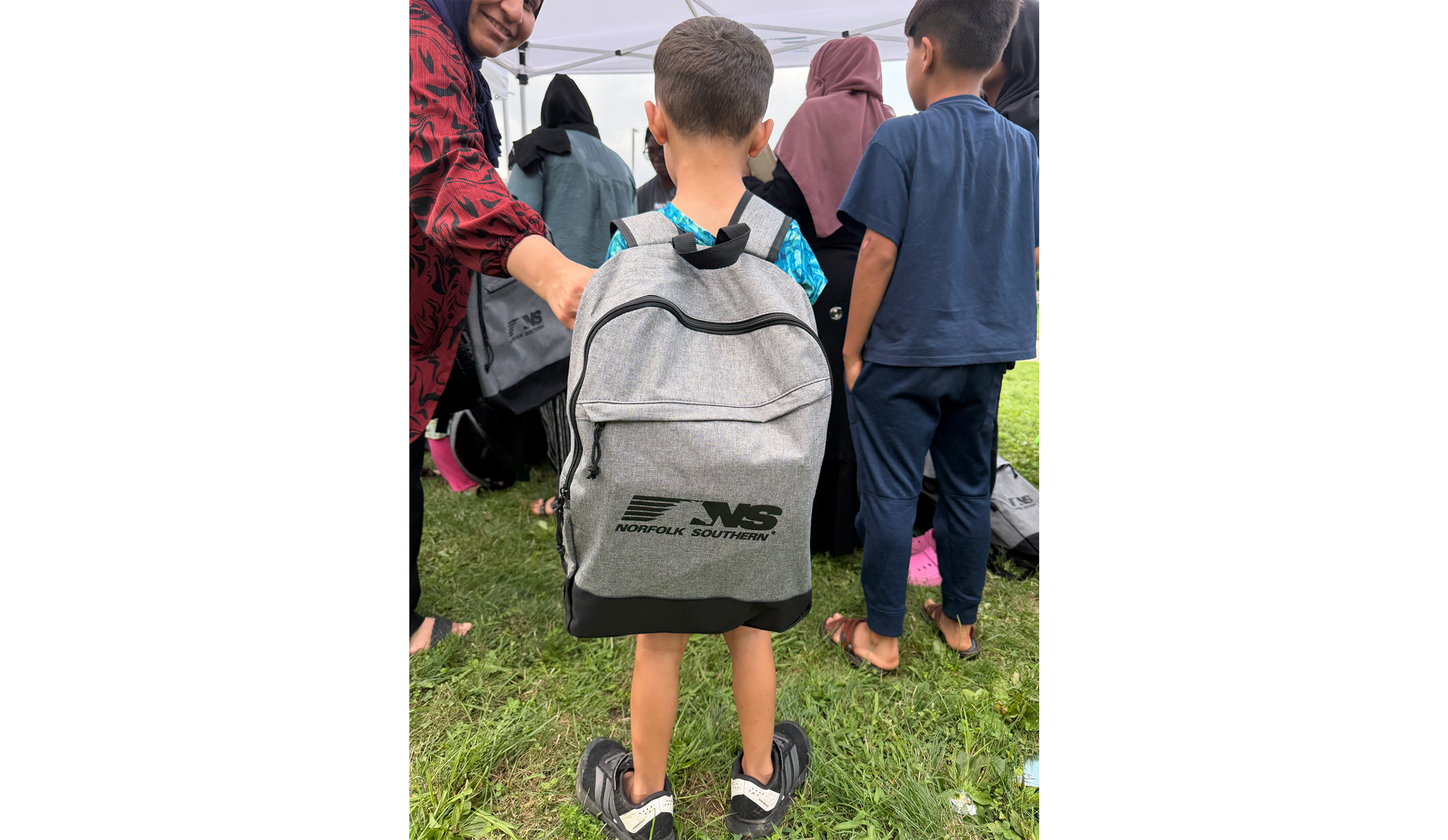 Child carrying Norfolk Southern backpack