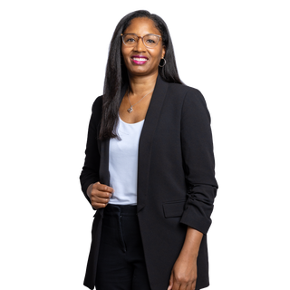 Image of Norfolk Southern a rail transportation company Director of DEI standing in a black suit