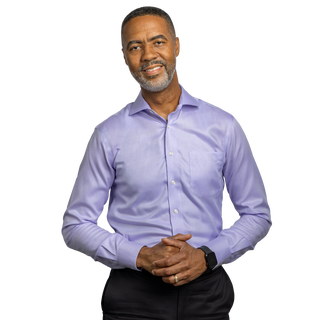Image of Norfolk Southern a rail transportation company VP of HR standing in a green suit