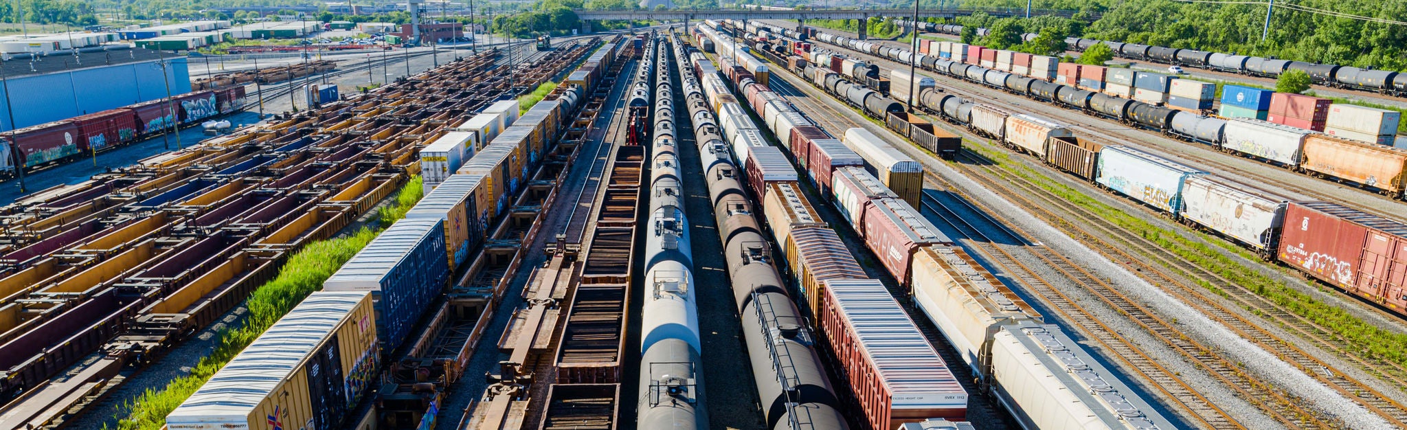 Aerial view of multiple Norfolk Southern trains on a train track ready to ship by rail