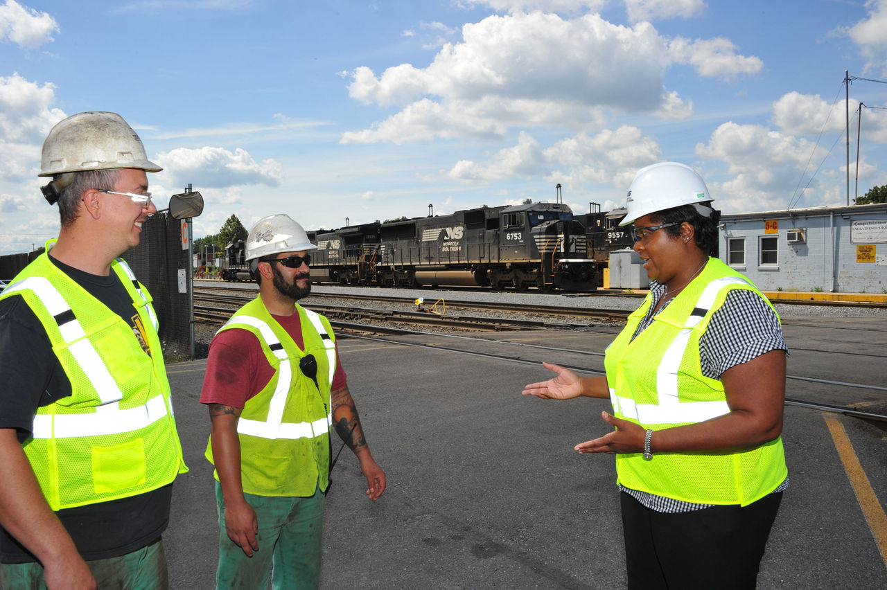 Dianne Barnett in the rail yard with colleagues