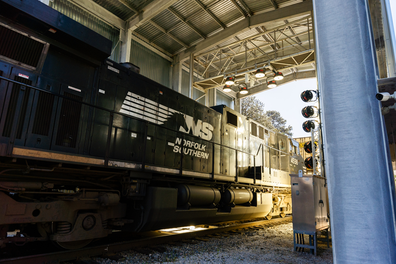 Norfolk Southern unveils a new automated train inspection portal near Jackson, Georgia, using advanced technology to prevent railway issues and ensure safe train operations.